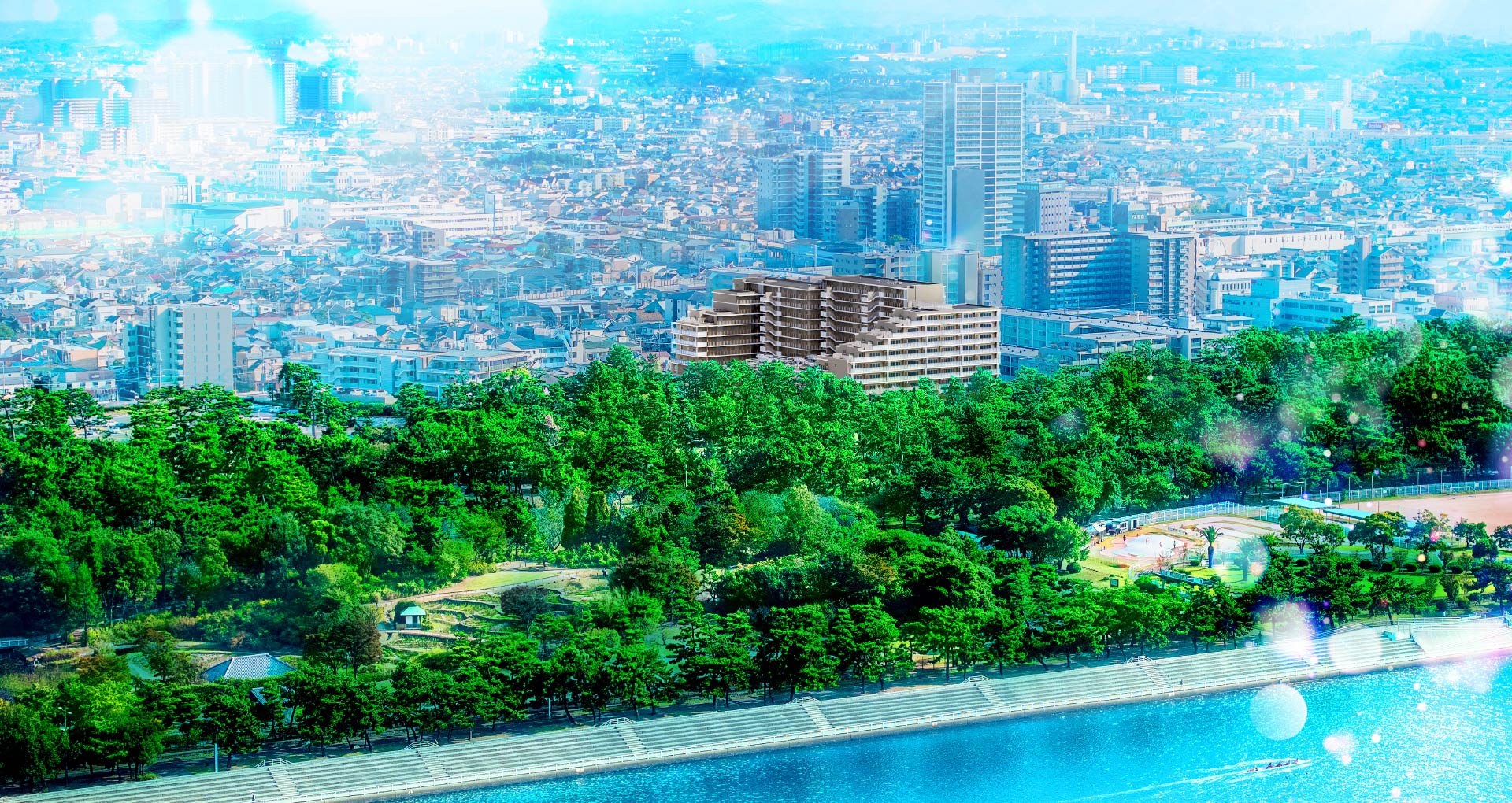 現地付近の航空写真に外観完成予想図を合成したCG